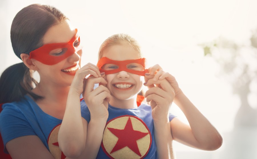A caring au pair helping a young child learn through play